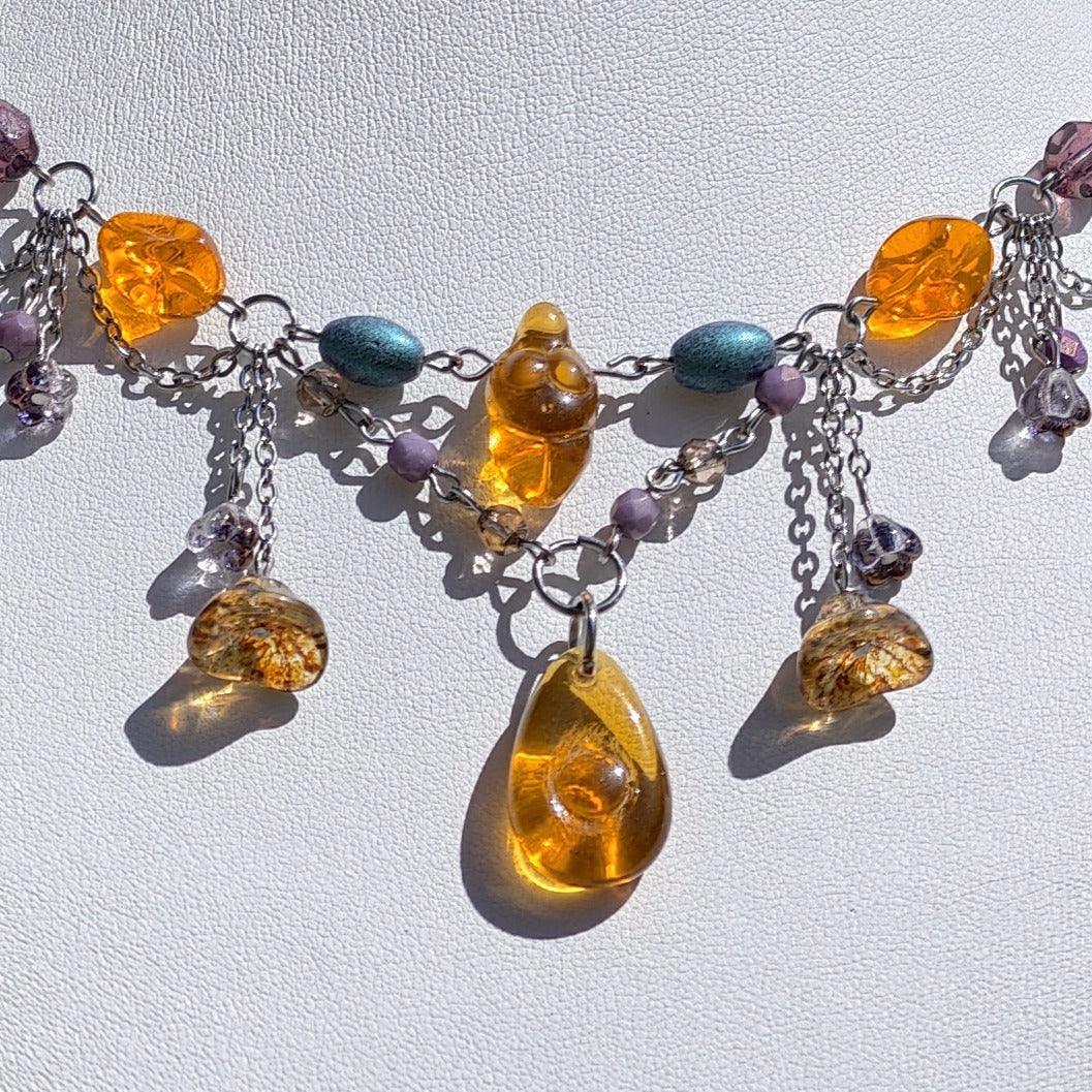 Venus of Willendorf, Fantasy Jewelry,  Handmade jewelry, Whimsical Jewelry, Unique Jewelry.  Royalcore Fairycore Jewelry, Orange and brown, Front zoomed