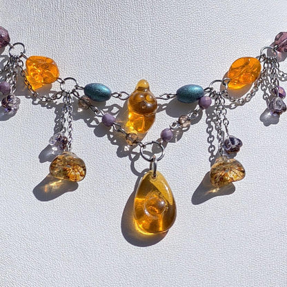 Venus of Willendorf, Fantasy Jewelry,  Handmade jewelry, Whimsical Jewelry, Unique Jewelry.  Royalcore Fairycore Jewelry, Orange and brown, Front zoomed